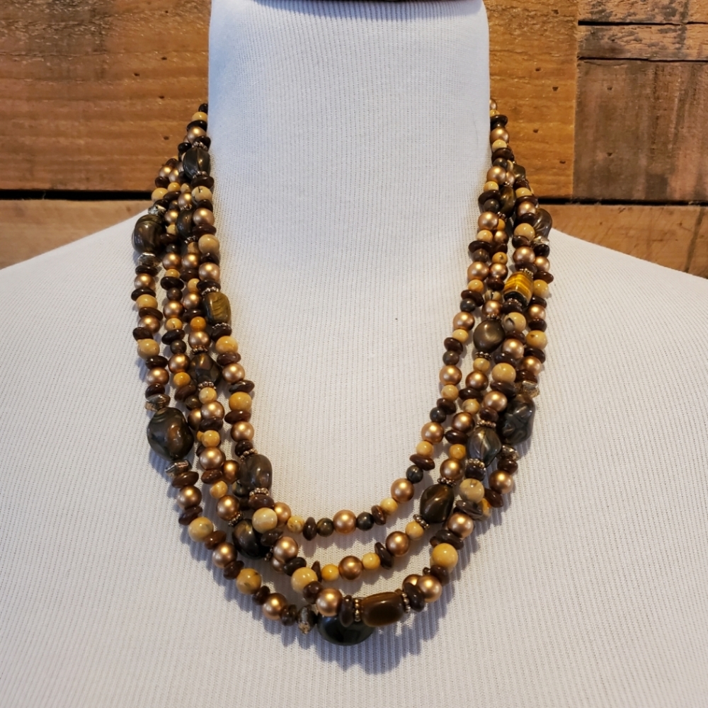 Multi-strand necklace in gold, brown, cream and faux tiger eye beads